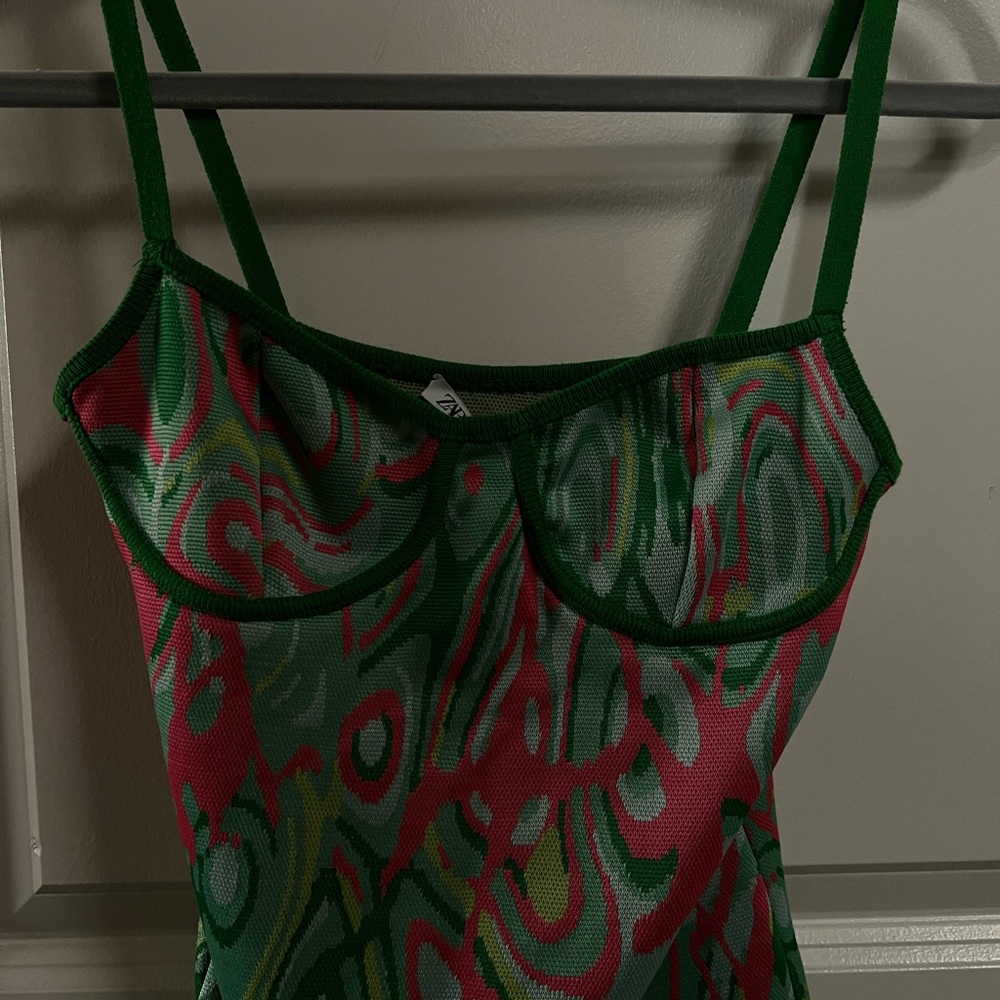 Green and Red Swirl Patterned Top